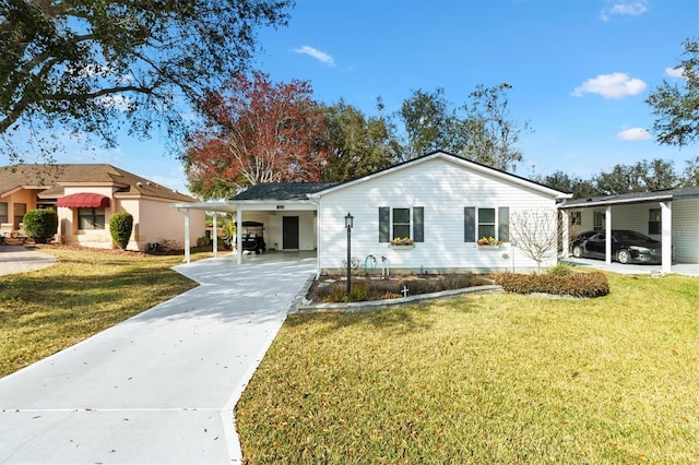 single story home with a front yard and a carport