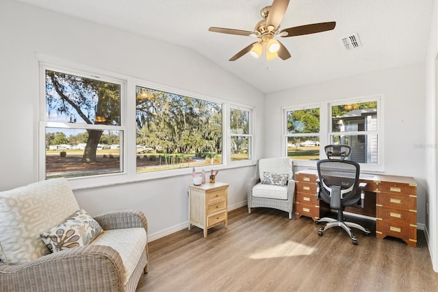 interior space with vaulted ceiling and ceiling fan