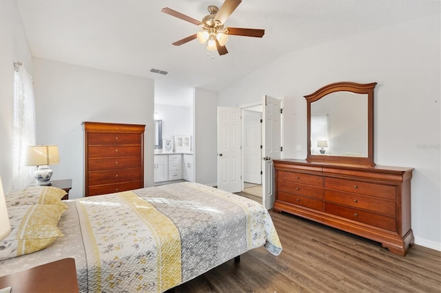 bedroom featuring dark wood-type flooring, ceiling fan, and connected bathroom