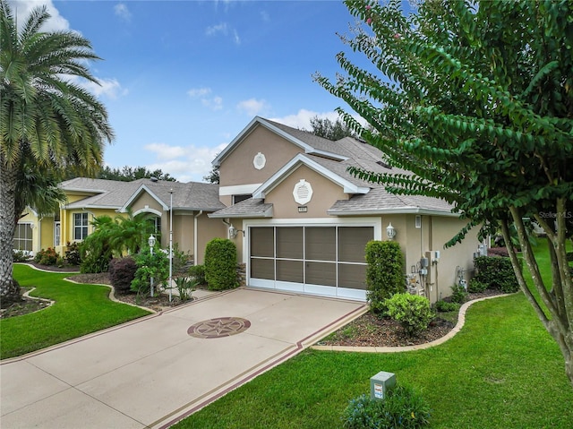 view of front of home featuring a garage and a front yard