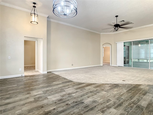 unfurnished living room with crown molding, hardwood / wood-style floors, and ceiling fan