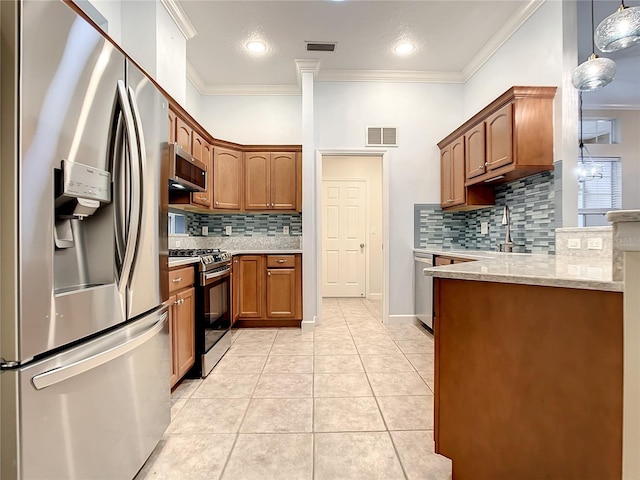 kitchen with tasteful backsplash, light tile patterned floors, ornamental molding, pendant lighting, and stainless steel appliances