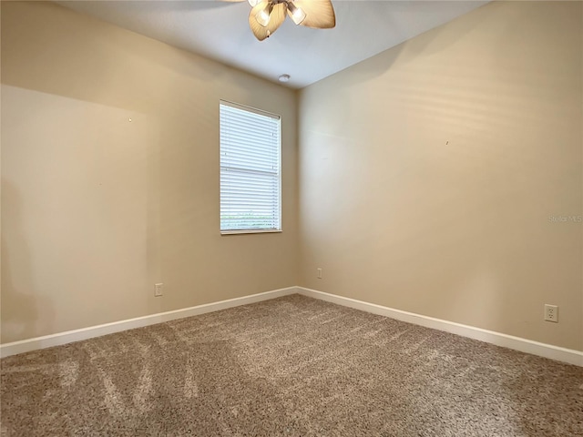 unfurnished room with vaulted ceiling, carpet, and ceiling fan