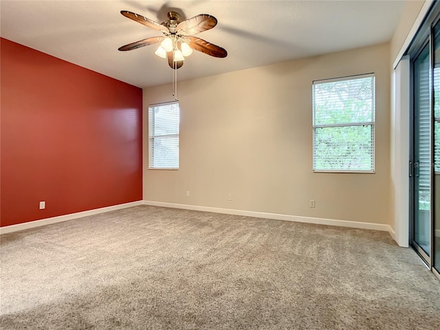 carpeted empty room with ceiling fan