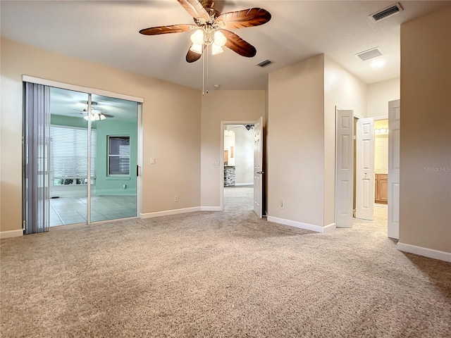 empty room with light colored carpet and ceiling fan