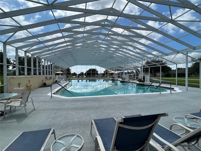 view of pool with a lanai and a patio area