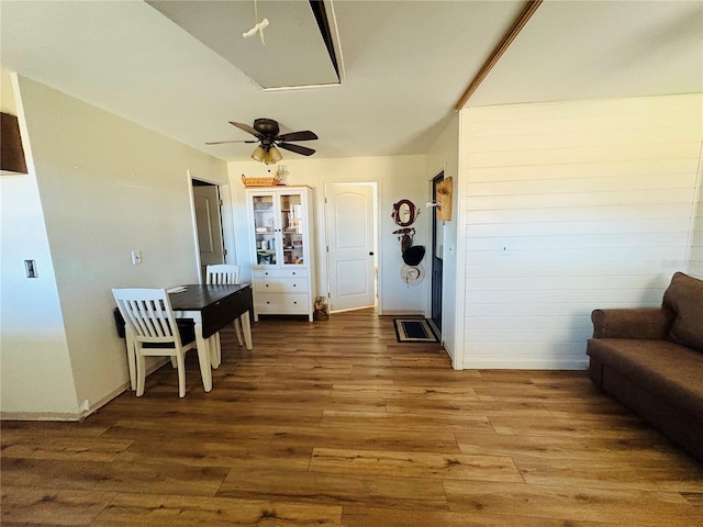 interior space featuring wood-type flooring and ceiling fan