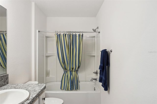 full bathroom with shower / bathtub combination with curtain, vanity, and toilet