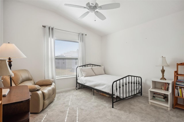 bedroom featuring ceiling fan, lofted ceiling, and light carpet