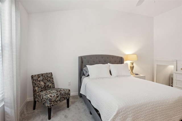 bedroom featuring light colored carpet and ceiling fan