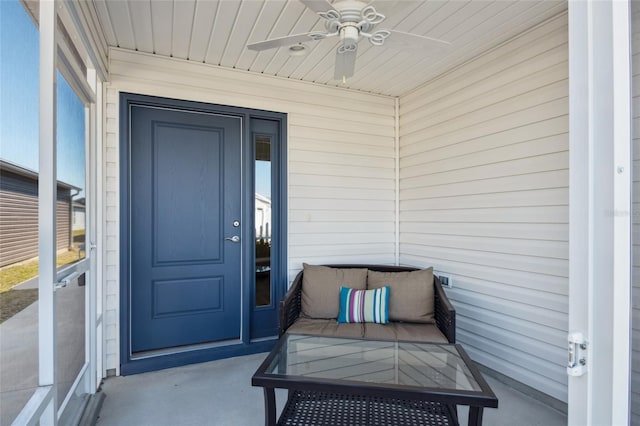 property entrance with ceiling fan