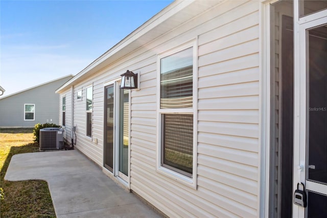 view of property exterior featuring central AC and a patio area