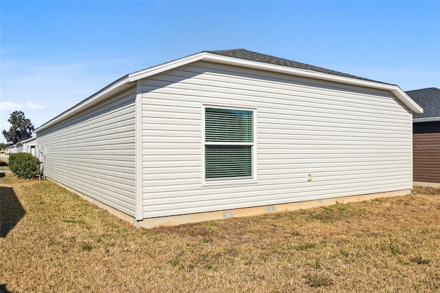 view of property exterior with a lawn