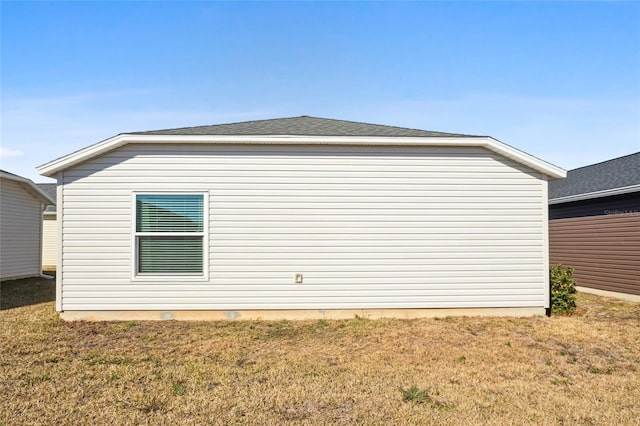 view of home's exterior featuring a yard