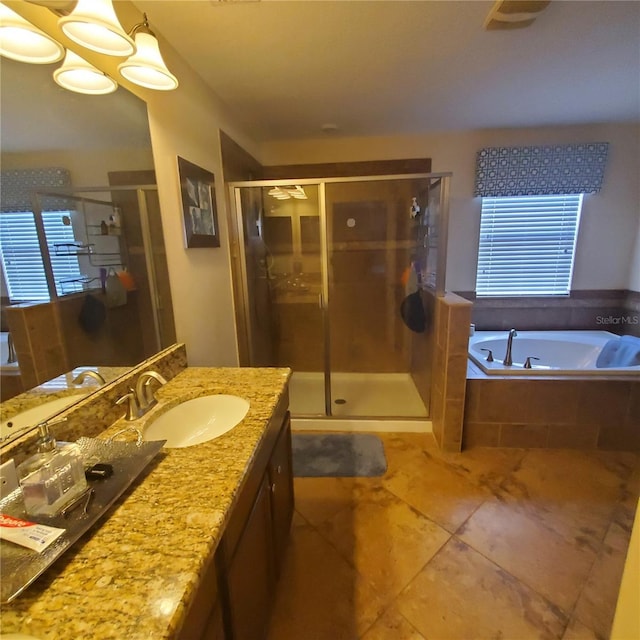 bathroom featuring vanity and separate shower and tub