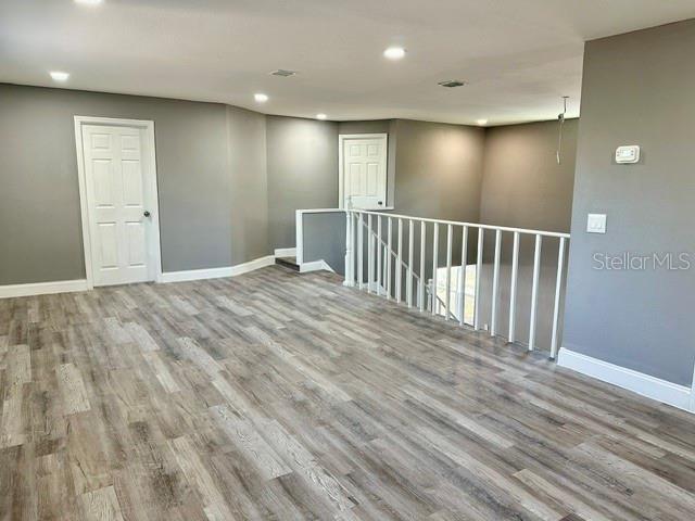 unfurnished room with light hardwood / wood-style flooring