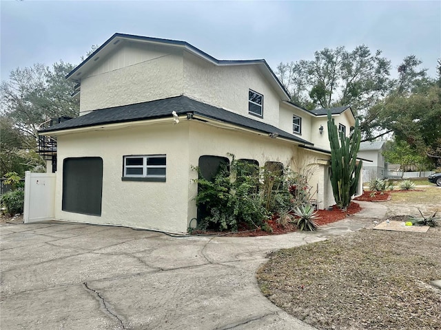 view of property exterior featuring a garage