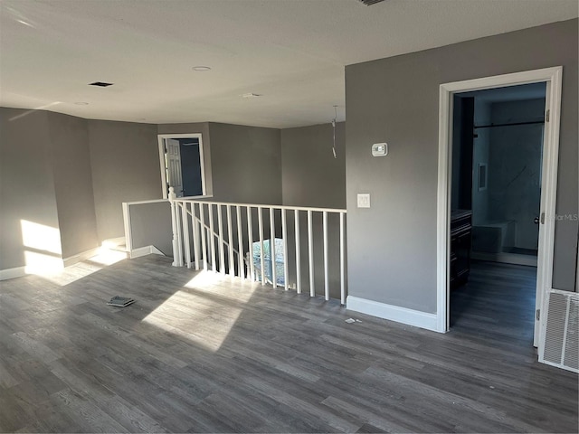 spare room with hardwood / wood-style floors