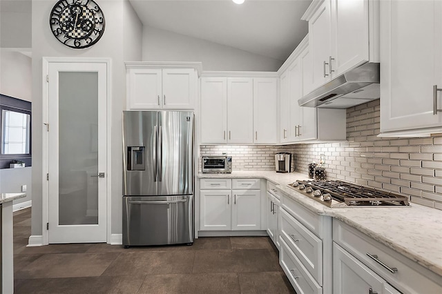 kitchen with white cabinetry, light stone countertops, and stainless steel appliances