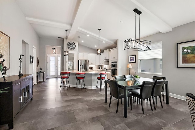 dining space featuring beamed ceiling and high vaulted ceiling