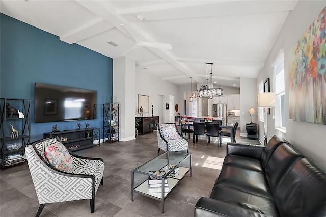 living room featuring beam ceiling, ceiling fan with notable chandelier, and high vaulted ceiling