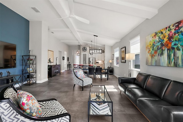 living room featuring ceiling fan and lofted ceiling with beams