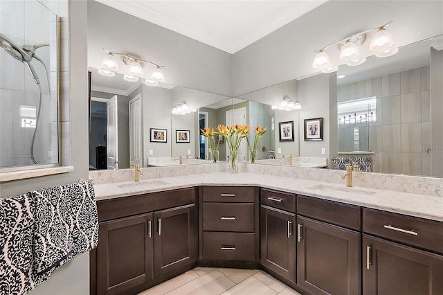 bathroom with walk in shower, ornamental molding, tile patterned floors, and vanity