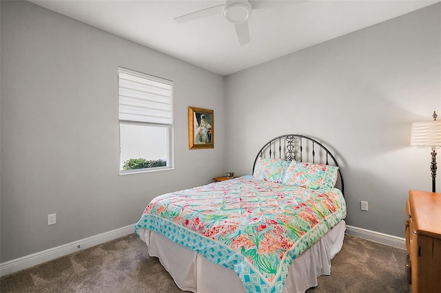 bedroom featuring ceiling fan and dark colored carpet