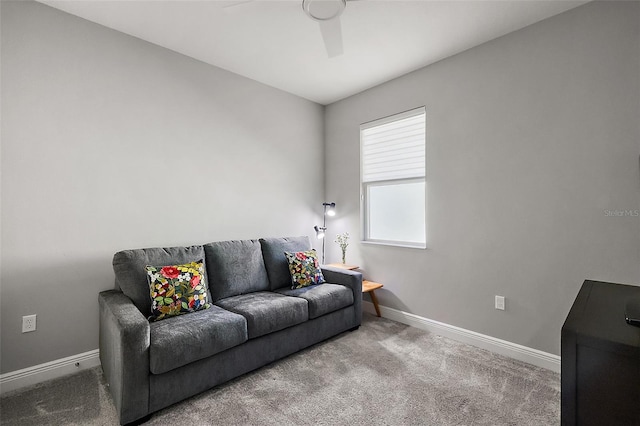 living room with ceiling fan and carpet flooring