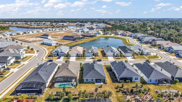 birds eye view of property featuring a water view