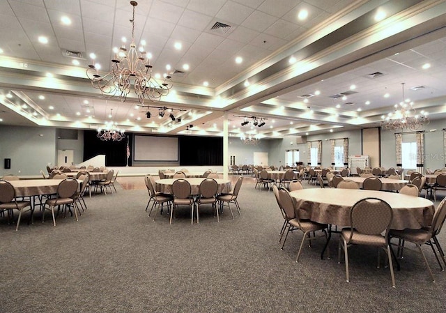 dining area featuring crown molding, a raised ceiling, and dark colored carpet