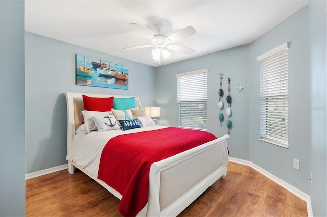 bedroom featuring hardwood / wood-style flooring and ceiling fan