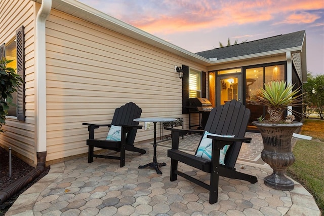 view of patio terrace at dusk