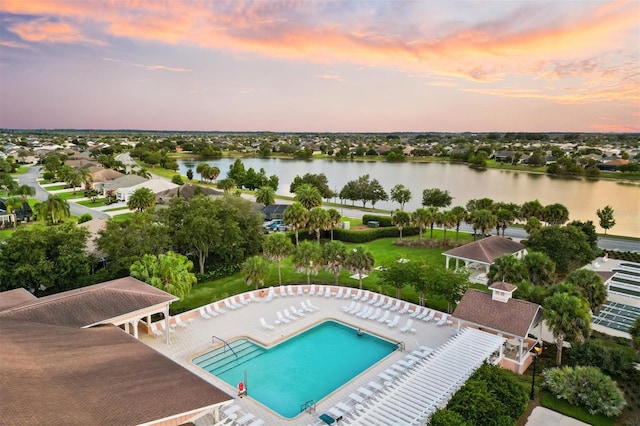 aerial view at dusk with a water view