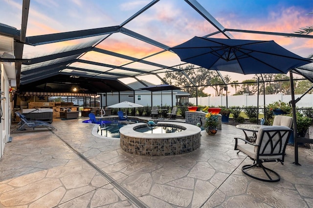 4515 Biggs Pl, The Villages, FL 32163 - view of patio / terrace with fence, a lanai, and a pool with connected hot tub
