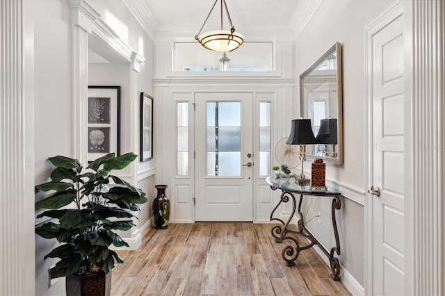4515 Biggs Pl, The Villages, FL 32163 - entryway featuring plenty of natural light, ornamental molding, and light wood-type flooring