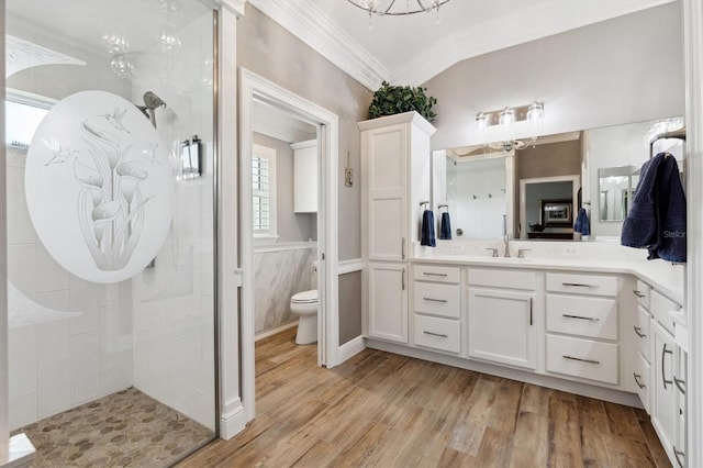 4515 Biggs Pl, The Villages, FL 32163 - full bath with vanity, toilet, a chandelier, wood finished floors, and tiled shower