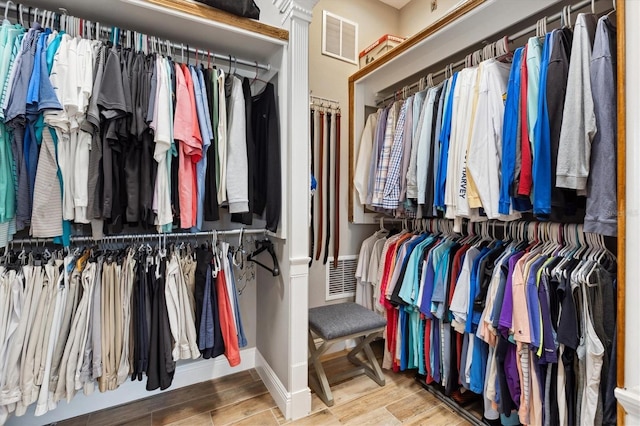 4515 Biggs Pl, The Villages, FL 32163 - spacious closet with visible vents and wood finished floors
