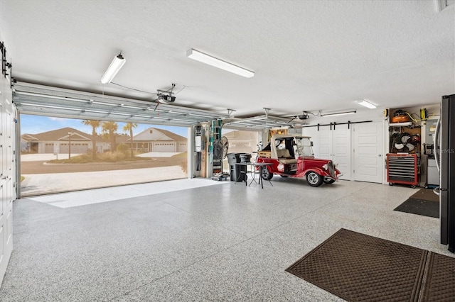 4515 Biggs Pl, The Villages, FL 32163 - garage featuring a garage door opener