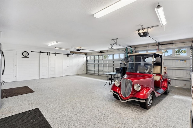 4515 Biggs Pl, The Villages, FL 32163 - garage featuring a garage door opener