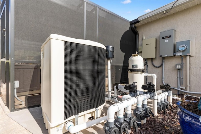 4515 Biggs Pl, The Villages, FL 32163 - exterior details featuring electric meter and stucco siding