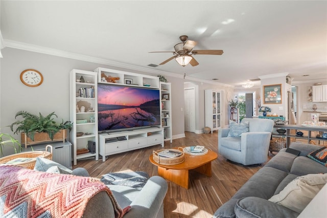 living room featuring ornamental molding, dark wood-type flooring, and ceiling fan