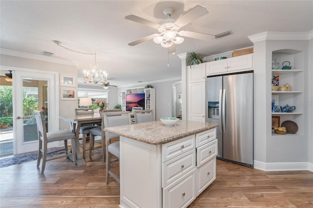 kitchen with white cabinetry, a center island, stainless steel fridge with ice dispenser, crown molding, and light hardwood / wood-style flooring