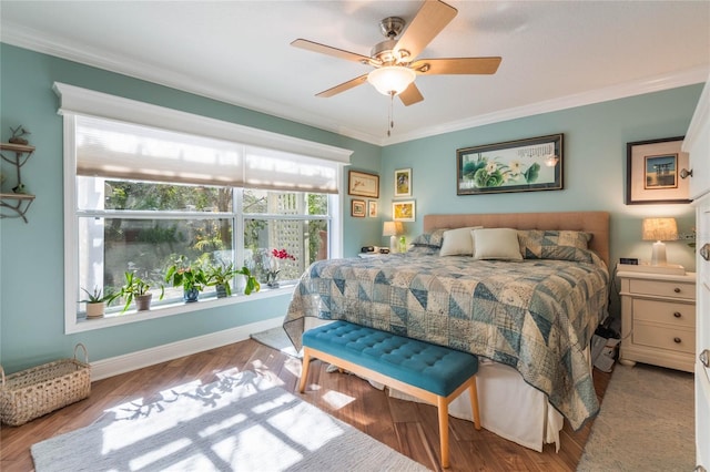 bedroom with crown molding, ceiling fan, and light wood-type flooring