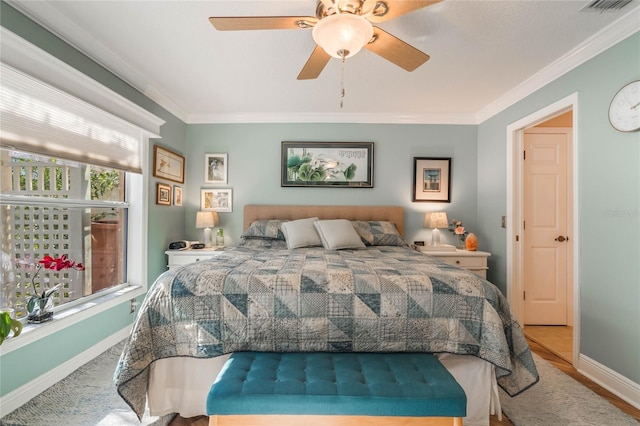 bedroom featuring ceiling fan and ornamental molding