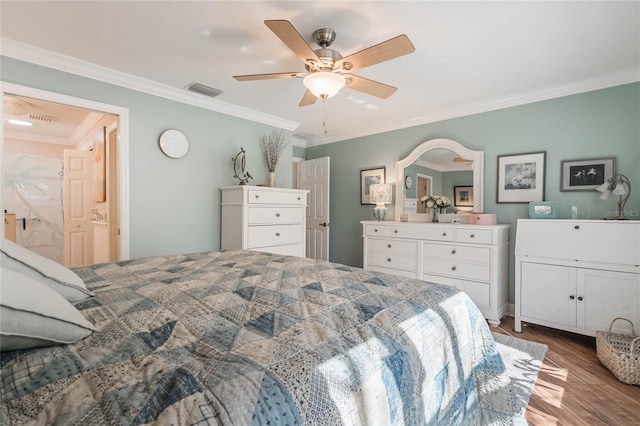 bedroom featuring ceiling fan, ornamental molding, and wood-type flooring