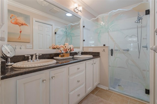 bathroom featuring a shower with door, ornamental molding, tile patterned flooring, and vanity