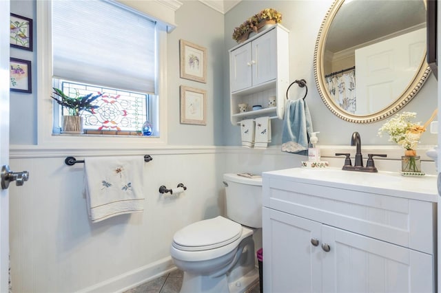 bathroom with tile patterned floors, vanity, and toilet