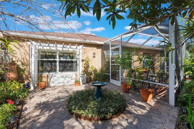 view of patio with a lanai