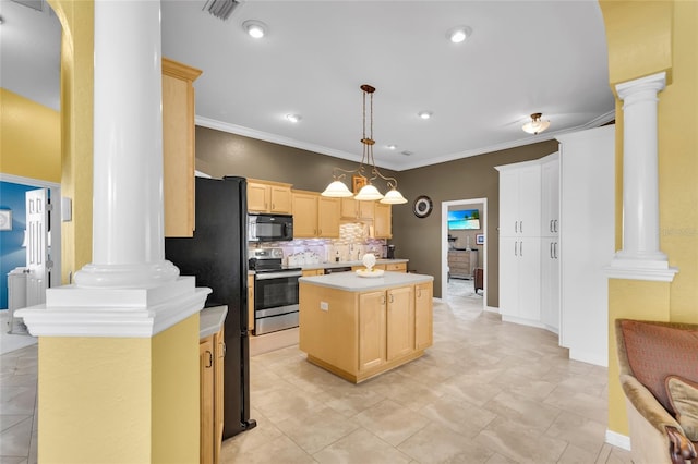 kitchen featuring light countertops, a center island, black appliances, decorative light fixtures, and ornate columns